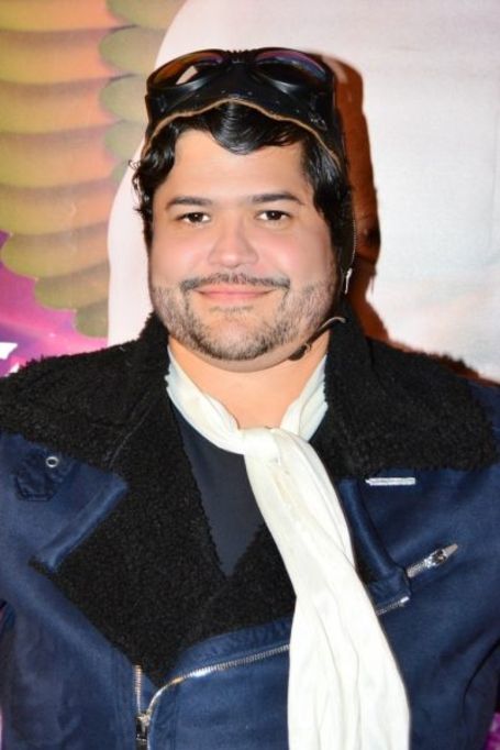 harvey wearing a blue jacket with white scarf 